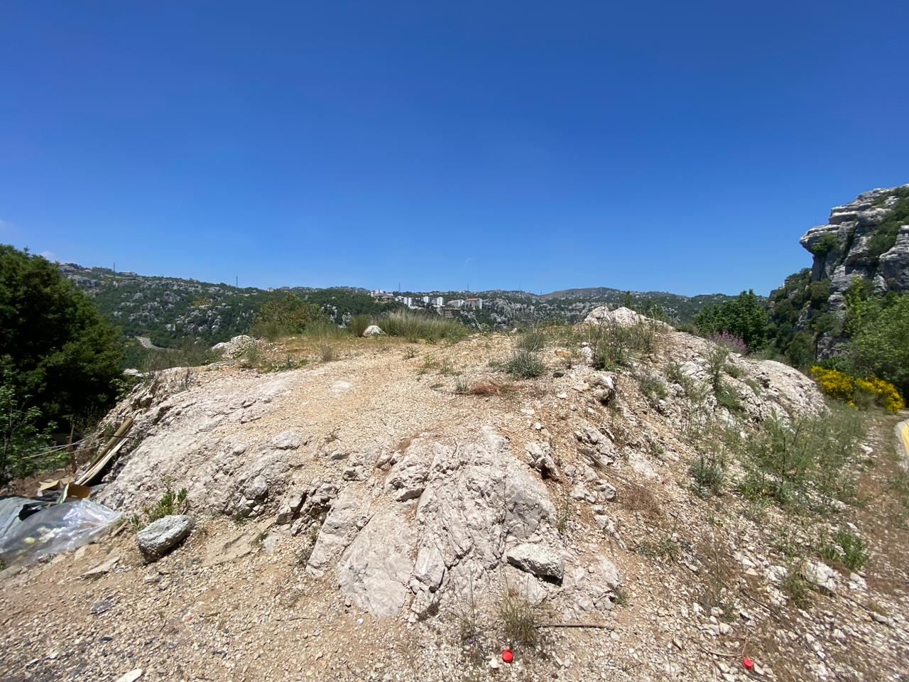 Land with a mountain view for sale in Kfarzebian, Keserwan