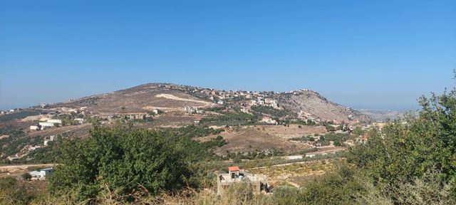 Land with a mountain view for sale in Koura